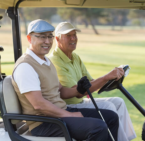 Golfers riding together in a golf cart